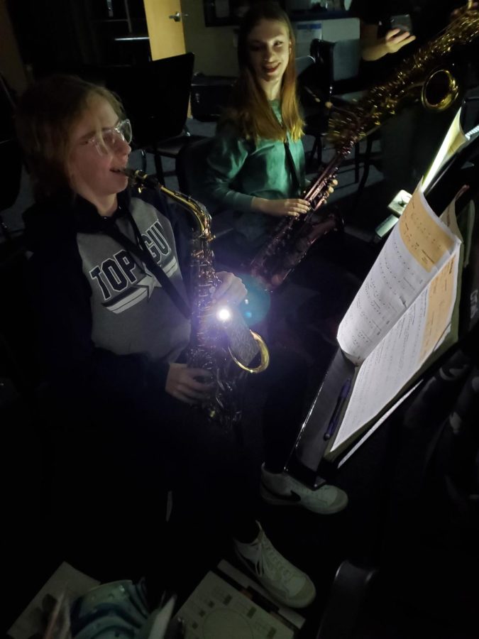 Students use phones to light up music.