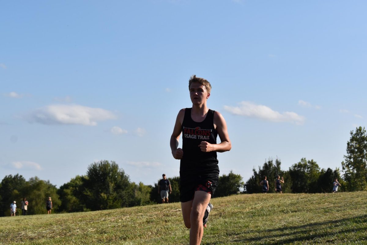 Jameson Lehane (8) heads toward the finish line in the cross-country meet at Grain Valley.