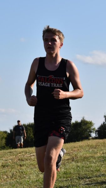 Jameson Lehane (8) heads toward the finish line in the cross-country meet at Grain Valley.