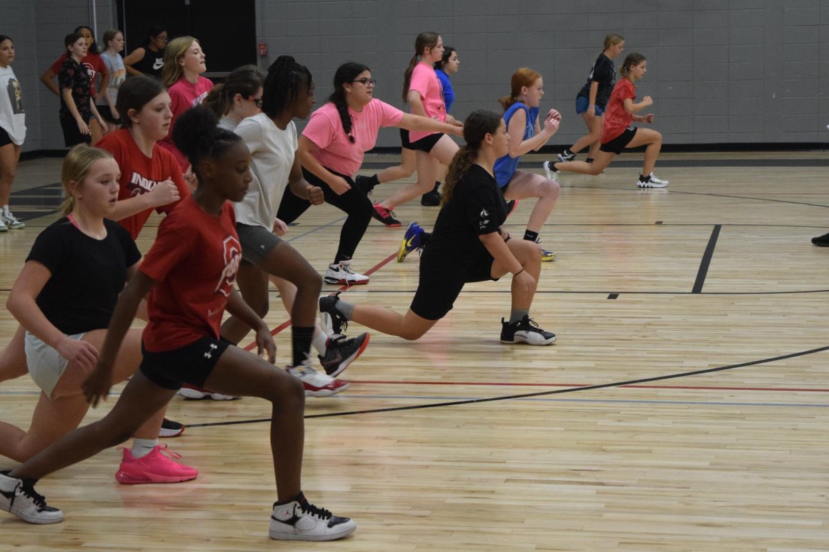 Seventh and eighth grade girls tryout out for basketball after school on Oct. 30. The beginning of practice required a lot of leg work like lunges and sprints.