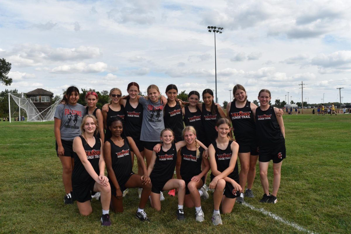 The girls cross country runners pose together before the start of the OTMS Invitational on Sept. 18. where 13 schools participated with over 150 runners. A team runner Madeline Rogers finished 14 with a time of 10:00:92. B team runner Trinety Hughes finished 47 with a time of 11:55:73.